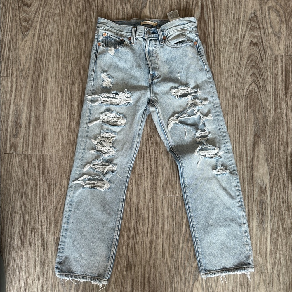 Levi’s light wash wedgie straight jeans with a lot of holes size 27